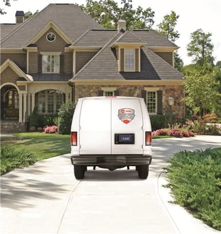 A Reinhardt Heating and Air service van on location in Matthews, NC