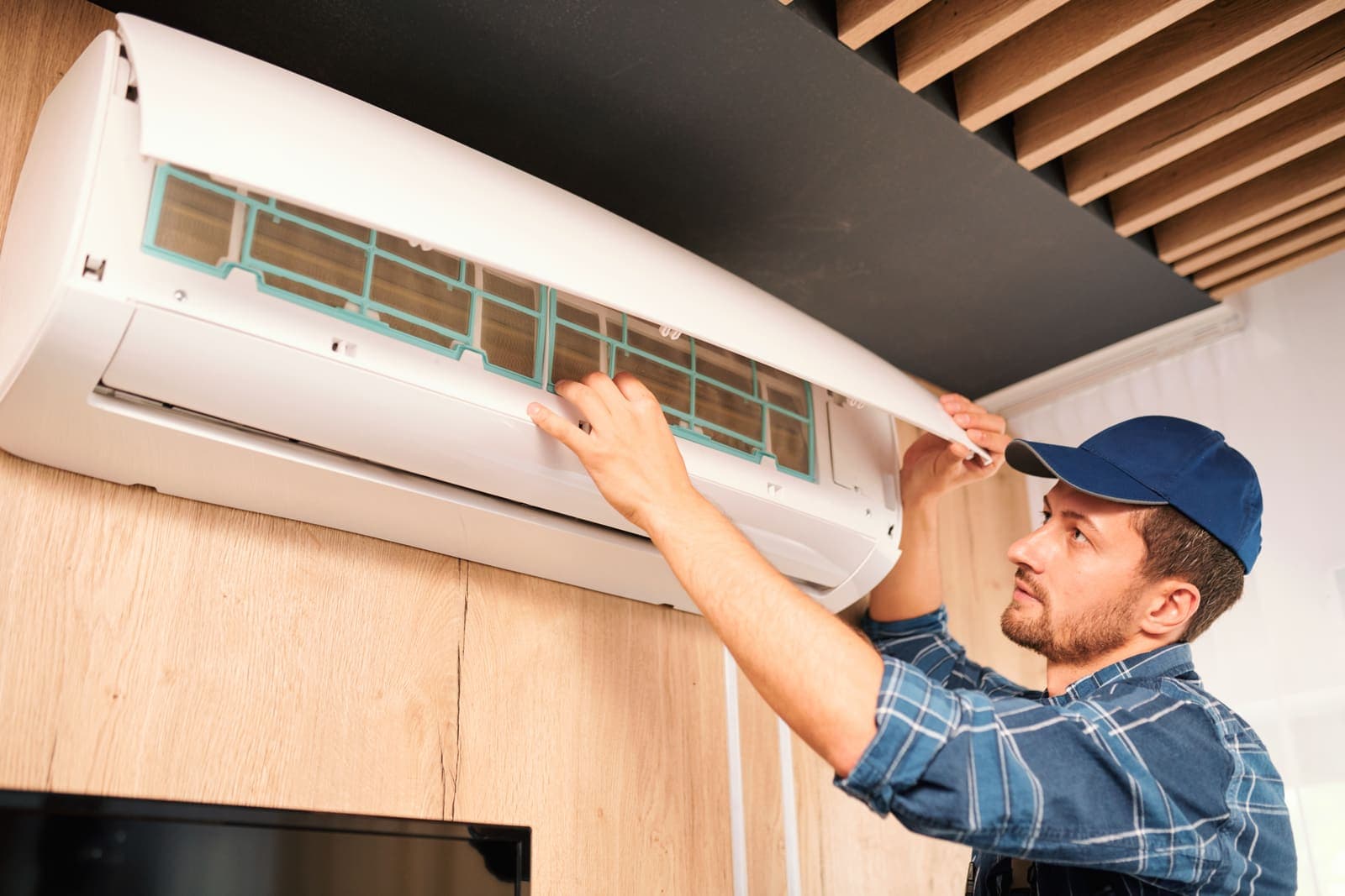 A technician installing a new air conditioning system